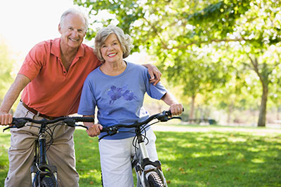 Elderly couple bicycling